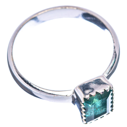 Sterling silver ring with rectangular faceted deep green emerald in prong setting
