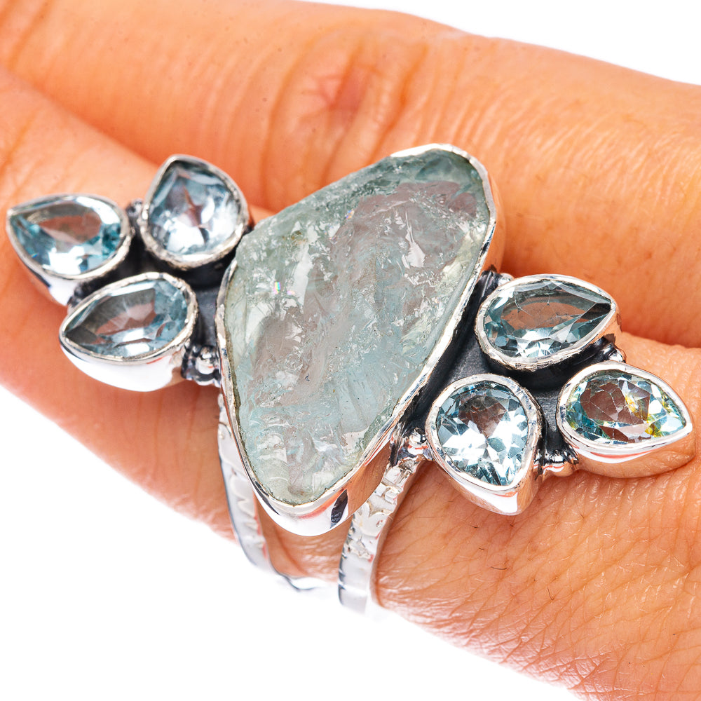 Sterling silver ring with rough aquamarine center and blue topaz teardrop accents