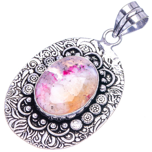 Pink dendritic opal pendant with ornate oval German silver frame and loop bail