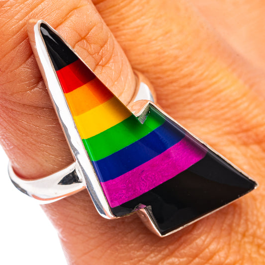 Rainbow bolt ring in sterling silver, rainbow stripes in black center, on finger
