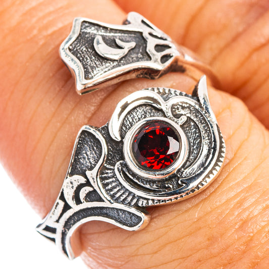 Red garnet-stone sterling silver ring close-up with detailed antique-style setting