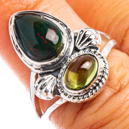 Sterling silver gemstone ring with dark green teardrop stone and oval peridot accents