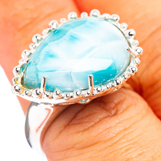 Oval blue larimar cabochon ring in .925 sterling silver with beaded halo
