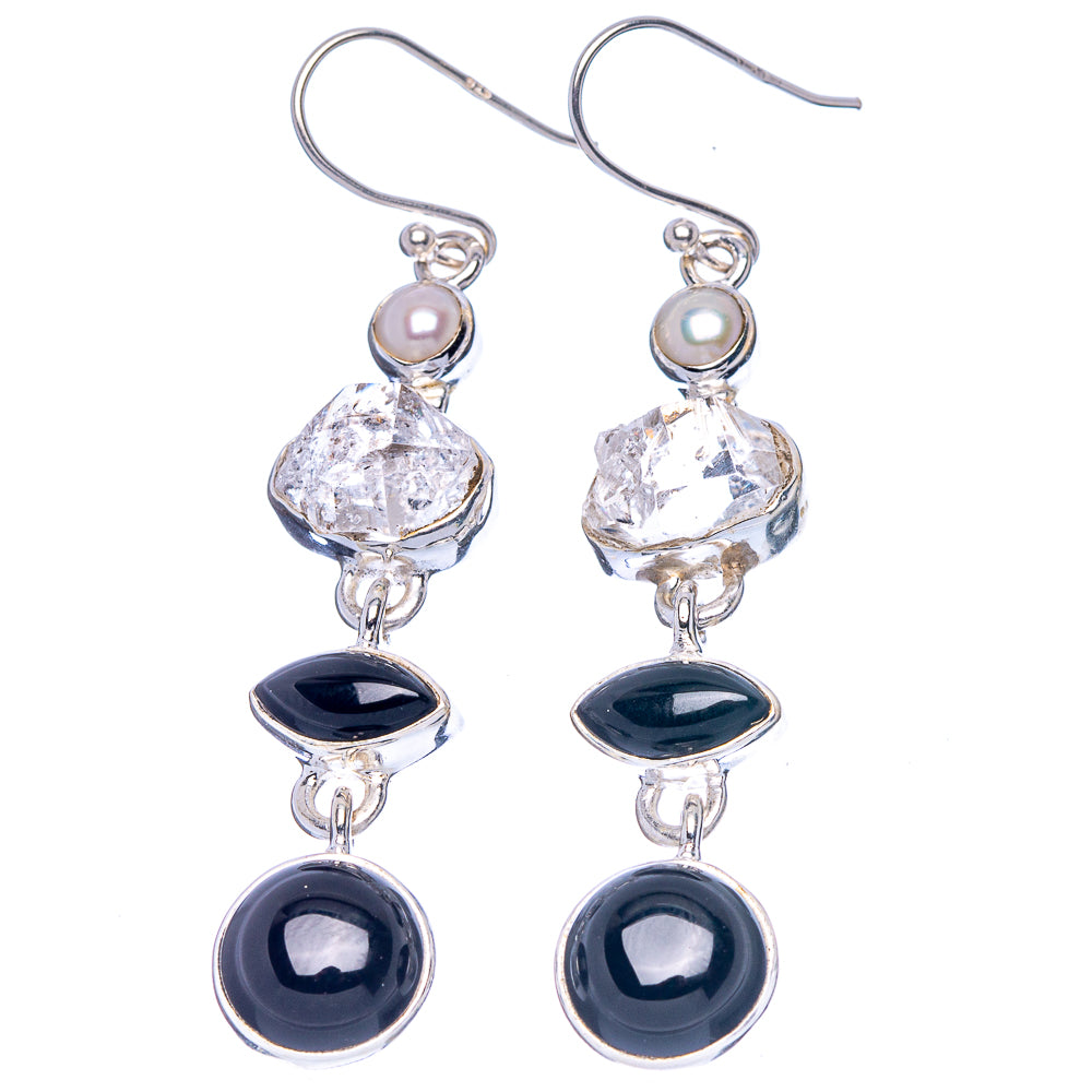 Sterling silver earrings with clear crystal, pale pearl, and dark onyx drops