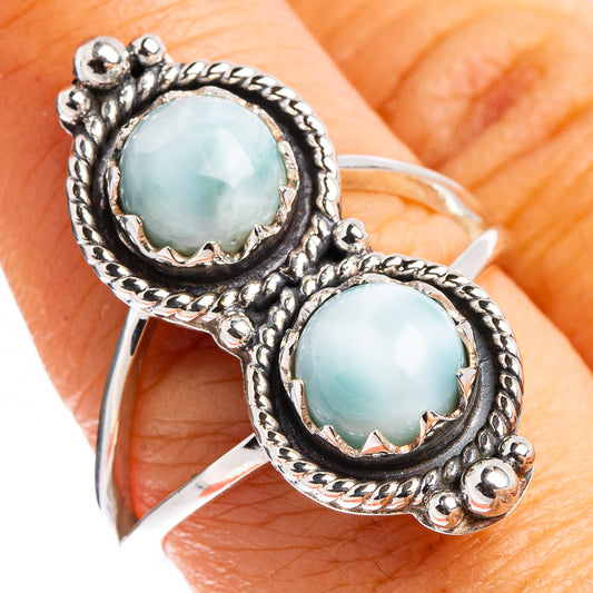 Sterling silver larimar ring with two oval light-blue stones and ornate twisted settings