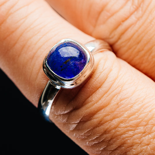 Sterling silver tanzanite ring with oval blue gemstone, bezel setting
