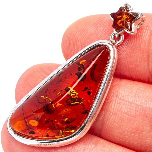 Amber star pendant with teardrop amber stone in .925 sterling silver setting
