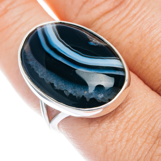 Sterling silver ring with oval black banded agate cabochon, blue band lines