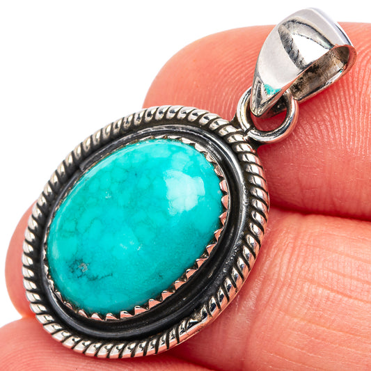 Oval turquoise cabochon pendant in .925 sterling silver with rope border bezel