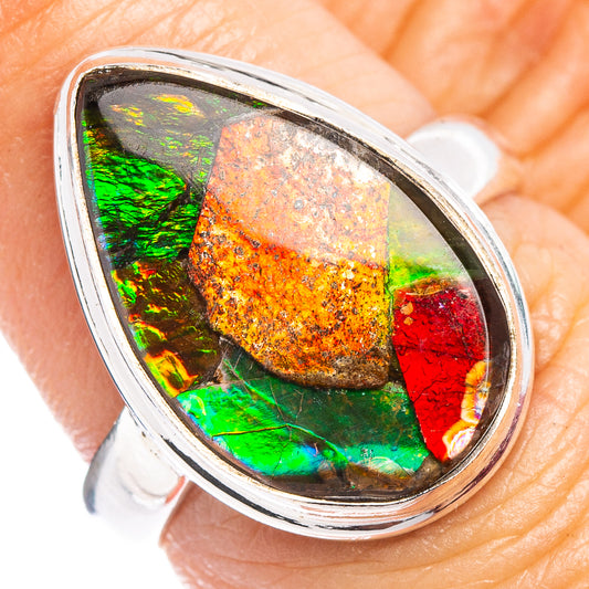 Oval ammolite ring with multicolor iridescent stone in a sterling silver bezel setting