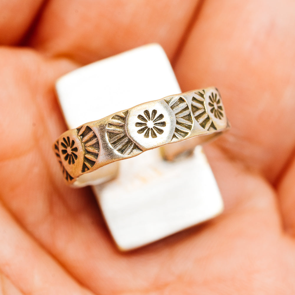 Southwestern silver ring band with stamped sunburst and diamond cutwork