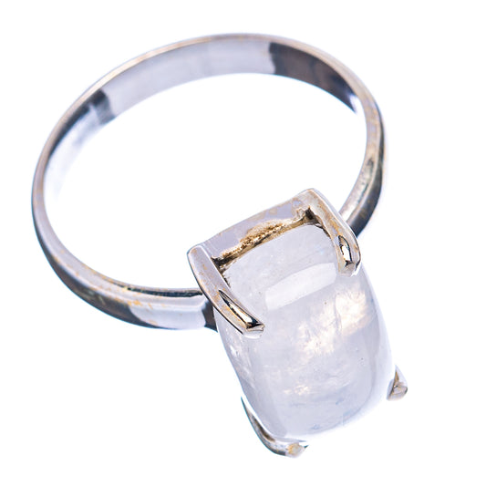 Moonstone ring showing rectangular silver bezel set with iridescent pale-blue stone