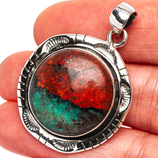 Round .925 sterling silver pendant with red, green earth-tone cabochon and bail