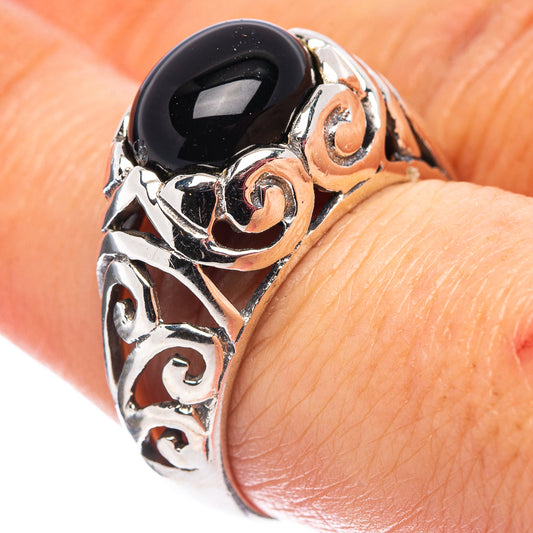 Sterling silver filigree ring with dark onyx-style oval center stone, size 7.75