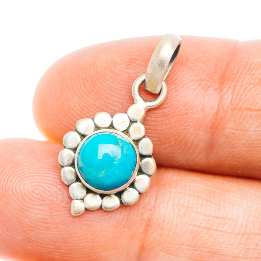 Turquoise pendant with round blue stone in silver bead bezel