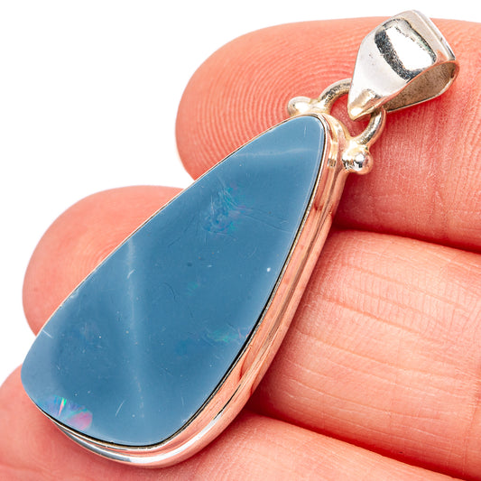 Gold-toned sterling opal pendant with blue teardrop stone and bail