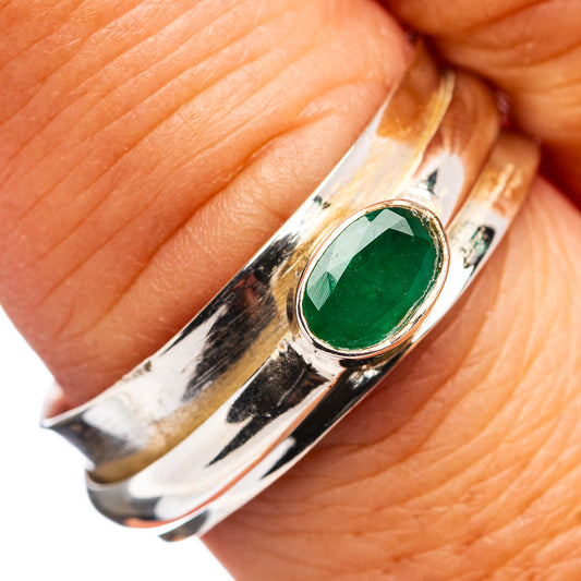 Sterling silver spinner ring with oval green gemstone bezel, size 9.25