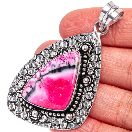 Pink dendritic opal teardrop pendant with ornate German silver bezel and bail