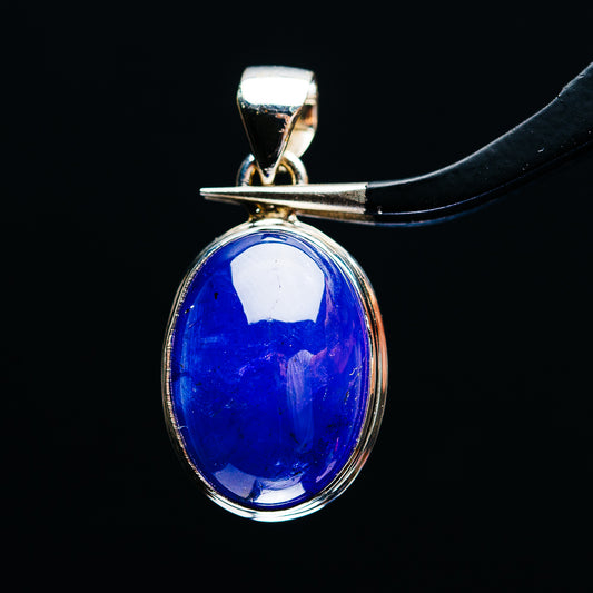 Oval blue tanzanite pendant with sterling silver bezel and bail