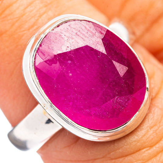 Oval ruby-color glass ring with polished .925 sterling silver setting, top view