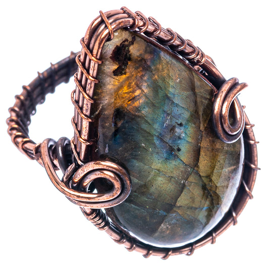 Oxidized copper wire-wrap ring with large oval labradorite stone and curled copper accents