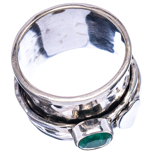 Sterling silver ring top view with round green gemstone and polished band