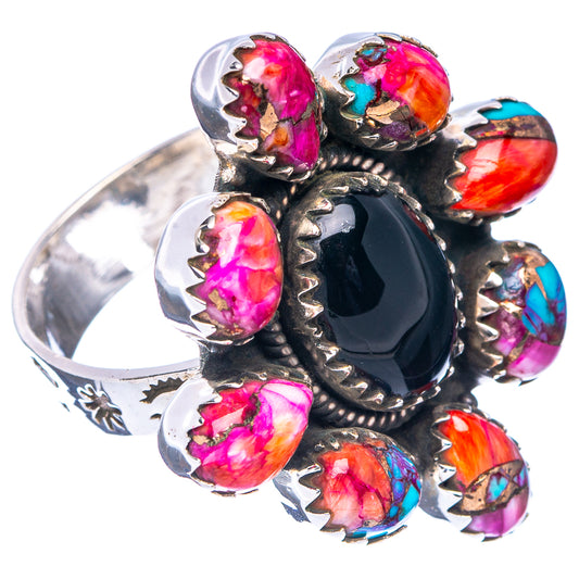 Adjustable sterling silver ring with black oval center and magenta, orange, blue stones
