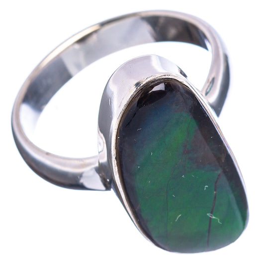 Sterling silver oval ring with dark green-blue iridescent ammolite in bezel mount.