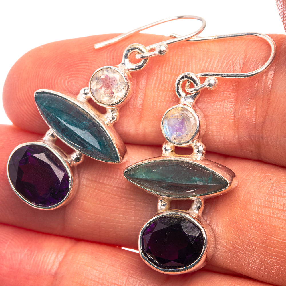 Sterling silver drop earrings with teal marquise, purple facets, and pale opalescent top
