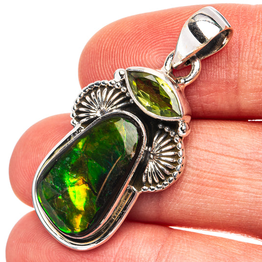 Sterling silver pendant with green ammolite and peridot accents, oval drop setting
