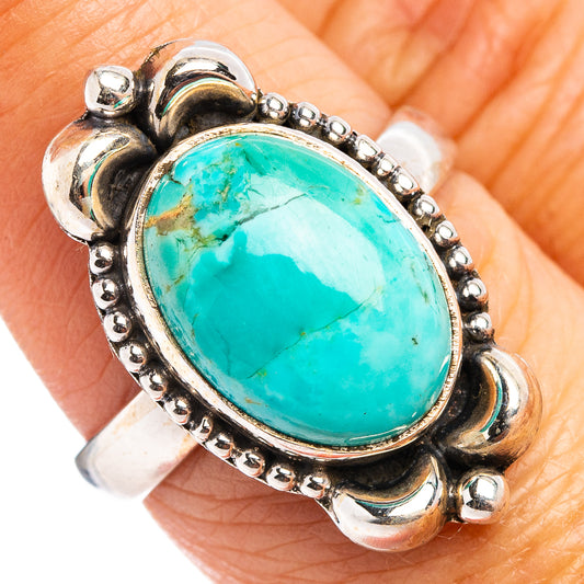 Oval turquoise cabochon ring in sterling silver with bead and scroll settings