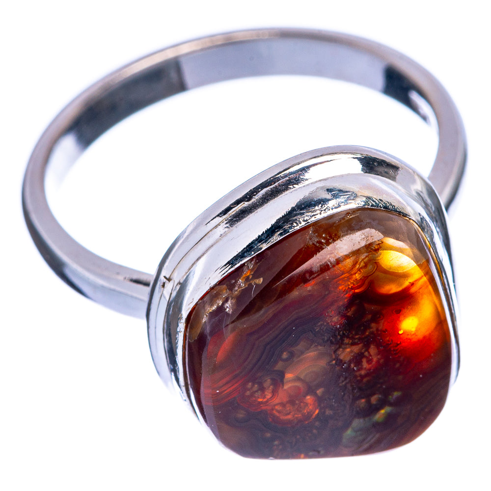 Sterling silver ring with oval fire agate stone in reflective bezel, side angle