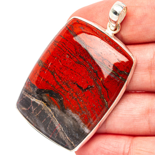 Red jasper pendant close-up with .925 sterling silver bezel and bail, rectangular cushion