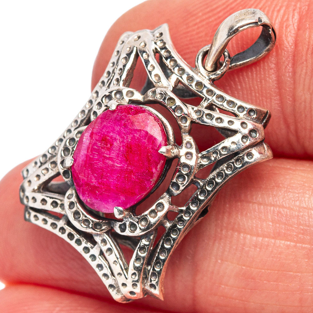 Red gemstone pendant in ornate .925 sterling silver setting, with loop bail