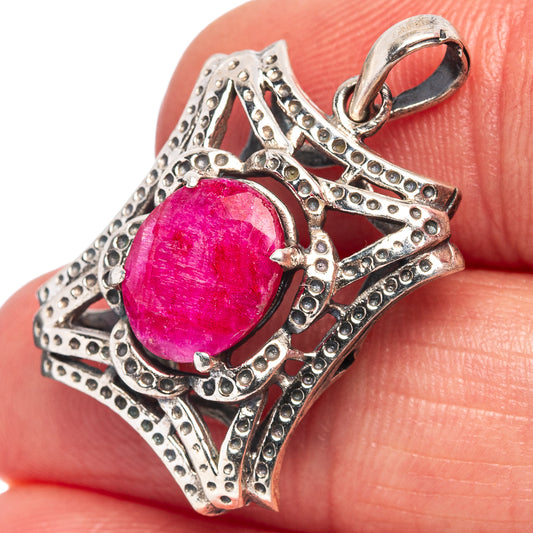 Red gemstone pendant in ornate .925 sterling silver setting, with loop bail
