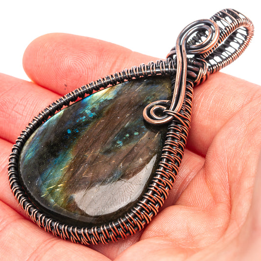 Oxidized copper wire-wrap pendant with teardrop labradorite stone, blue-green sheen