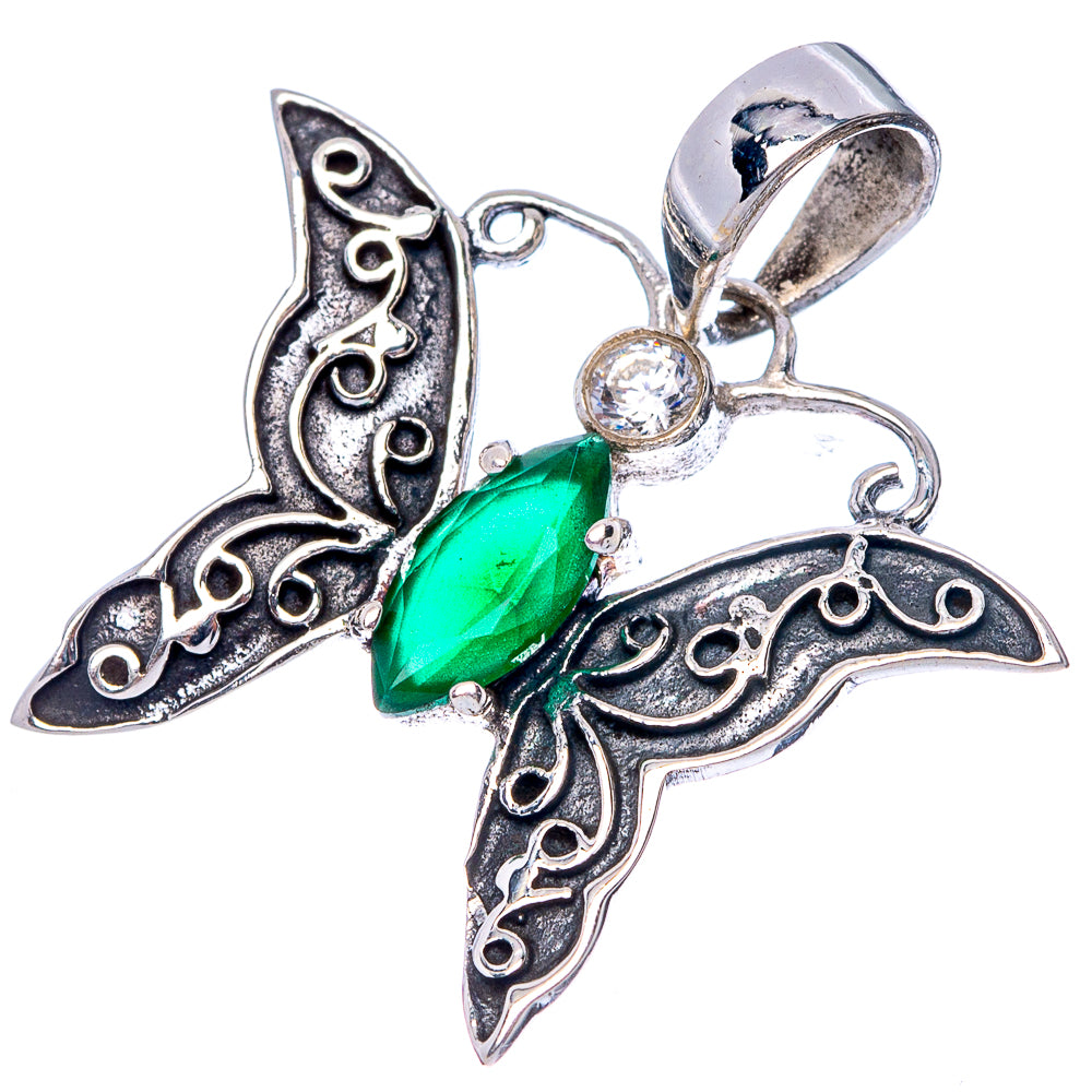 Openwork silver butterfly pendant with green gemstone, round clear center, and bail.