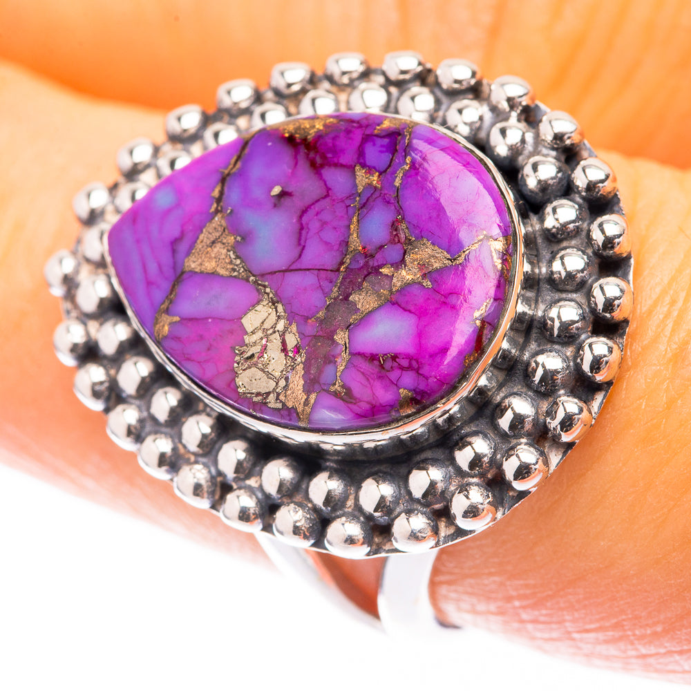 Purple turquoise cabochon ring with beaded sterling silver bezel and band.