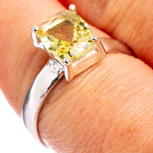 Sterling silver ring with faceted lemon quartz centerpiece, open prong setting