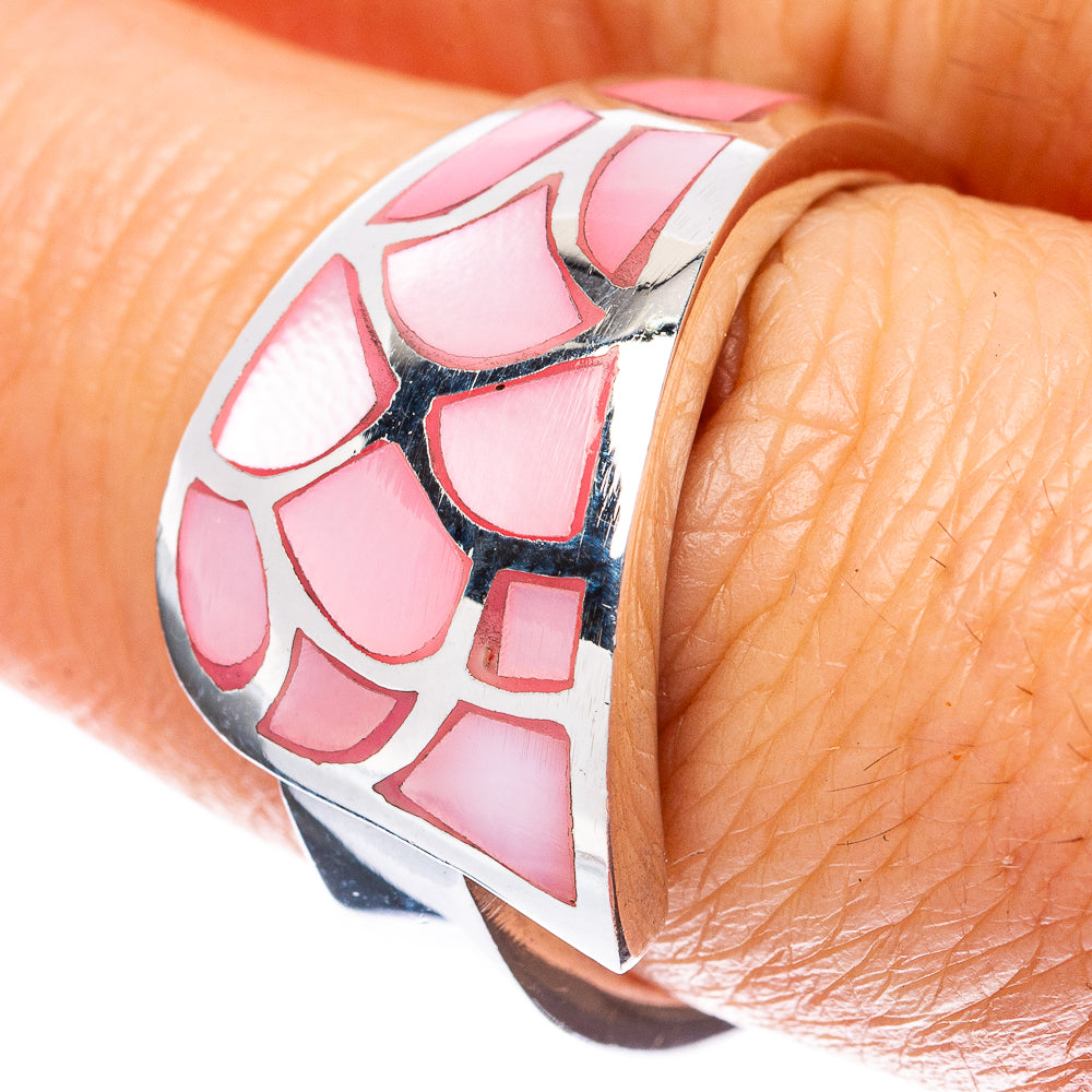 Sterling silver ring with pink mother-of-pearl geometric inlay on finger