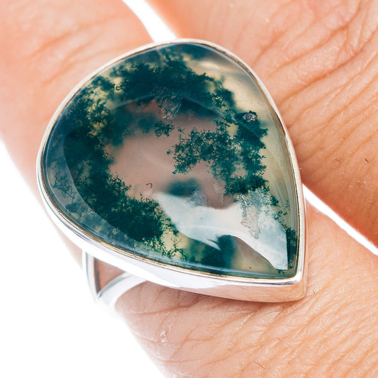 Moss agate teardrop ring with dark green dendritic stone in silver bezel setting