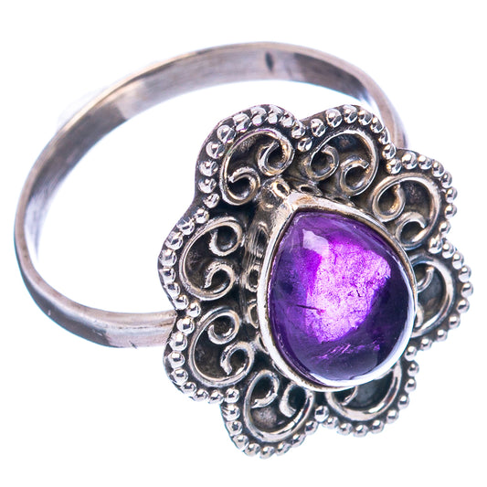Sterling silver amethyst ring with oval purple gemstone and filigree setting