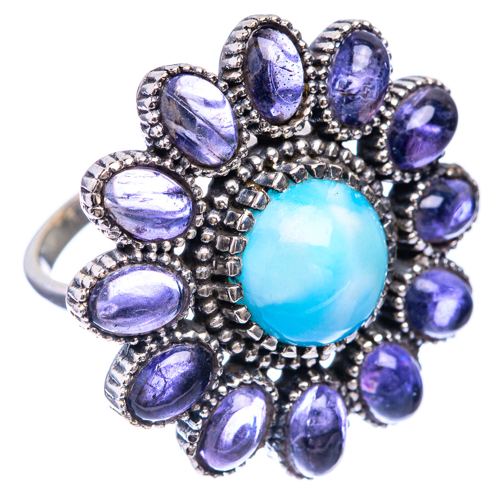Sterling silver ring with oval blue cabochon and purple oval gemstones, ornate halo