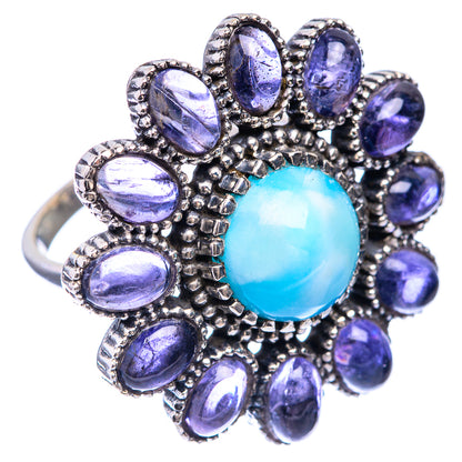 Sterling silver ring with oval blue cabochon and purple oval gemstones, ornate halo