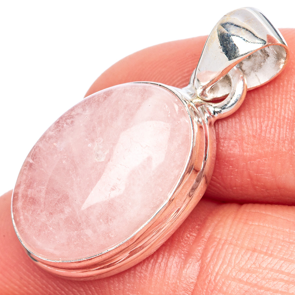 Oval pink morganite pendant in 925 sterling silver on finger