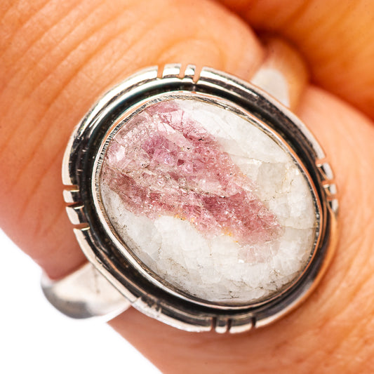 Oval pink tourmaline in quartz cabochon sterling silver ring with black rim detail