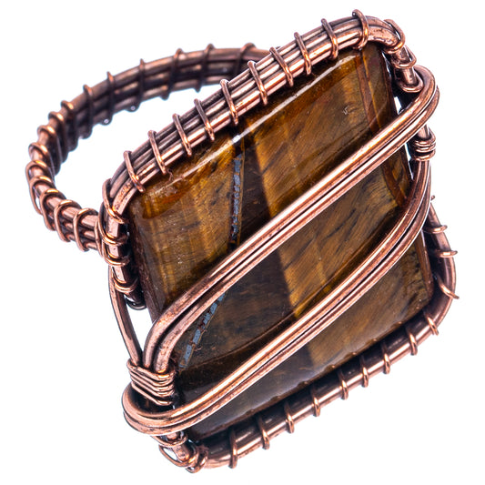 Oxidized copper wire wrap ring with rectangular tiger's eye stone, side view with bands