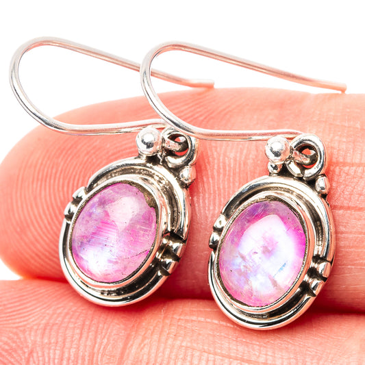 Sterling silver hoop earrings with oval pink moonstone cabochons and ornate halo settings