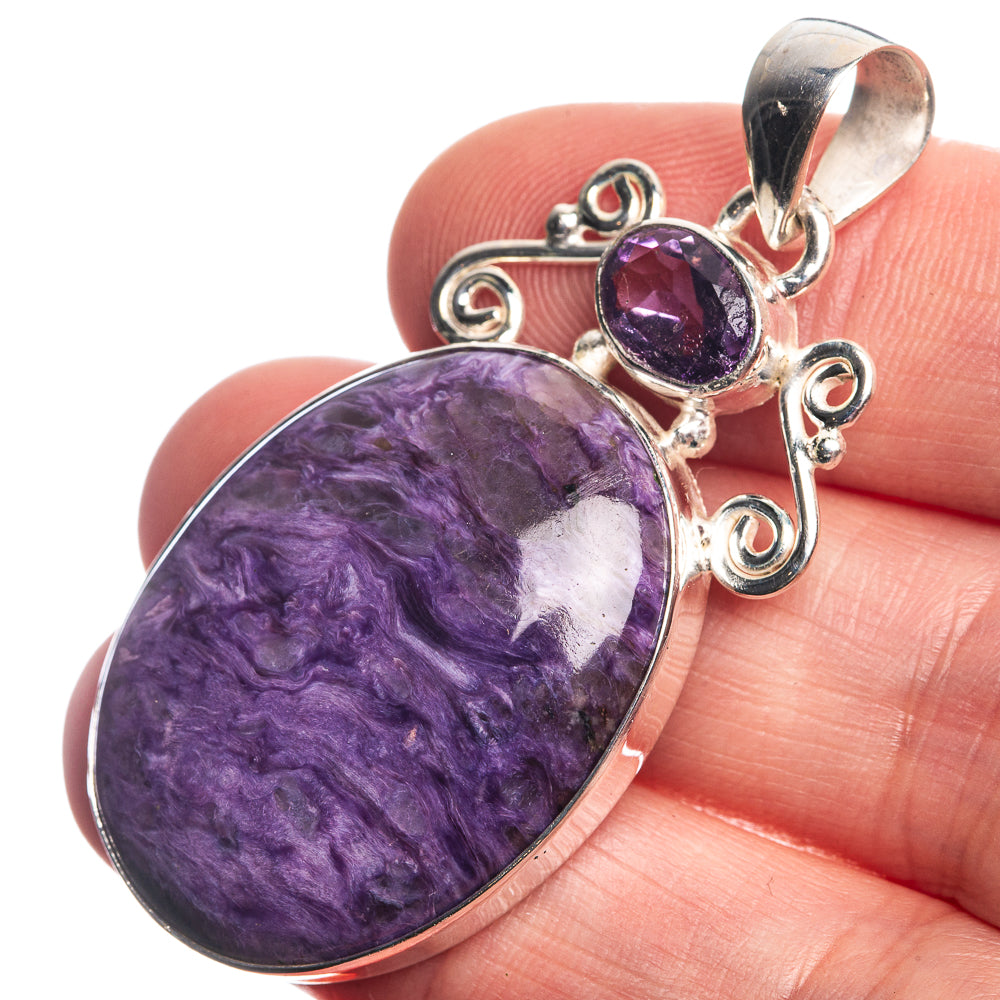 Sterling silver pendant with large oval purple cabochon and small amethyst drop charm