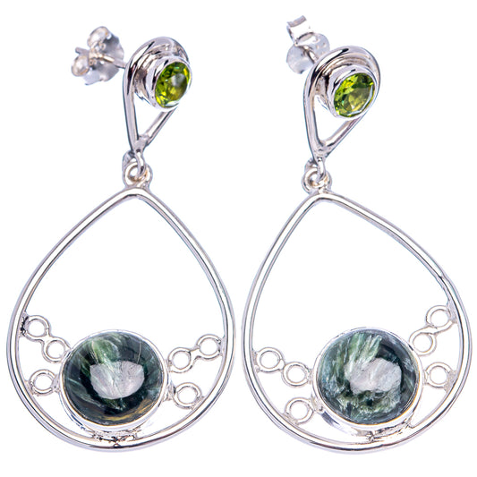 Sterling silver teardrop earrings with dark serpentine cabochons and green peridot tops
